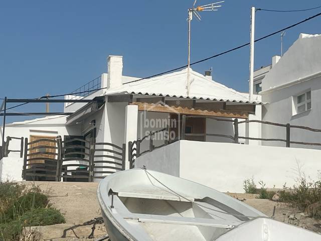 Tradition fisherman's cottage at the edge of the sea. Es Grau. Menorca