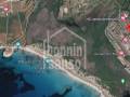 520 m2 großes Baugrundstück mit Projekt und Lizenz in Son Bou an der Südküste Menorcas mit Meerblick