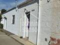 Terreno rústico con almacén agrícola en es Migjorn Gran, Menorca .