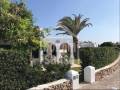 Encantador chalet adosado con jardín en un complejo en Cap d'Artrutx, Menorca