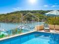 Chalet con impresionantes vistas sobre el puerto de Addaia y la espectacular costa escarpada que se extiende hasta el horizonte, Menorca